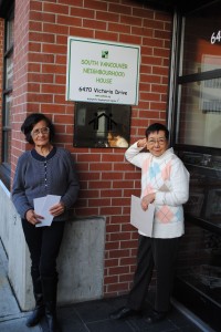 Juanita Aquirre, left, and Florchita Bautista, right, standing outside the South Vancouver Neighbourhood House. Photo by Erin Boe.