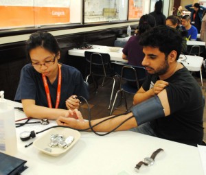 First year nursing student Dynne Gaborni practices measuring blood pressure on a Langara student. (Erin Boe)
